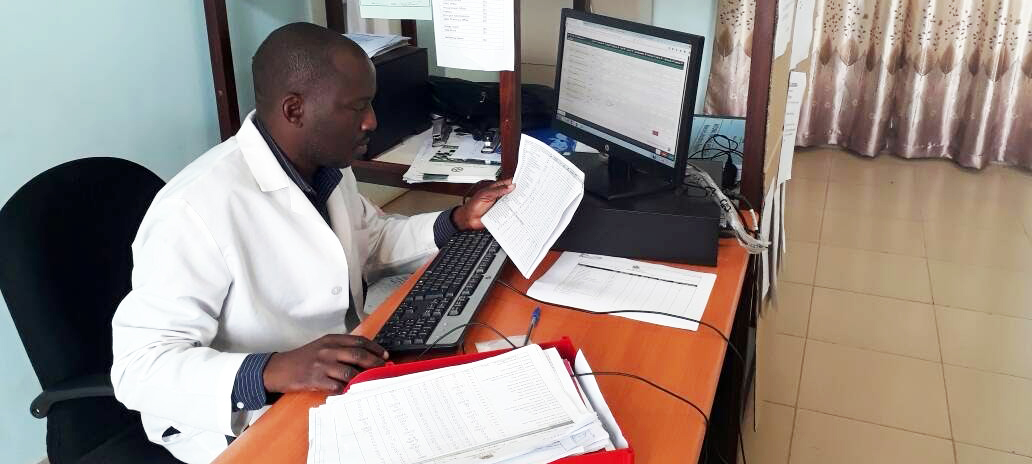 A pharmacy technician from Nkhata Bay district captures health facility data for OpenLMIS during deployment. Photo credit: GHSC-PSM