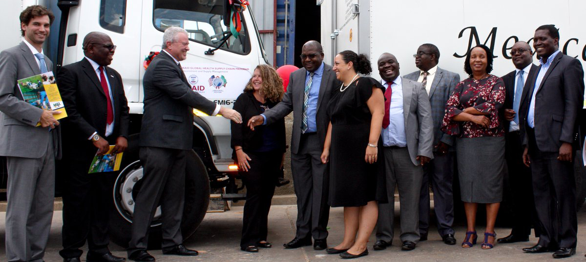 U.S. and Zambian leaders participate in a handover ceremony for 12 trucks donated by the U.S. to Zambia for medicine delivery. Photo credit: USAID/Zambia