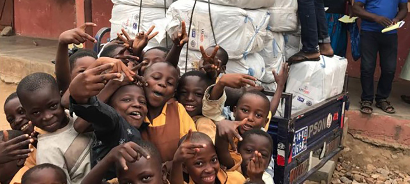 School children in the Kasenna-Nankana District pose with latest LLINs delivery. Photo Credit: GHSC-PSM