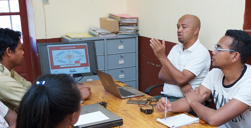 GHSC-PSM staff in Ankazobe, Madagascar review quantification protocol. Photo credit: Lan Andrian