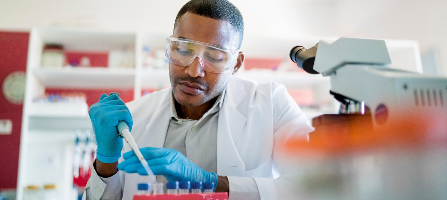 A man uses a pipette