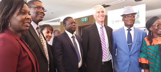  U.S. Ambassador Peter Barlerin, Cameroonian Ministry of Health officials and the project staff at the Closing Meeting of the customized Playbook for Cameroon.