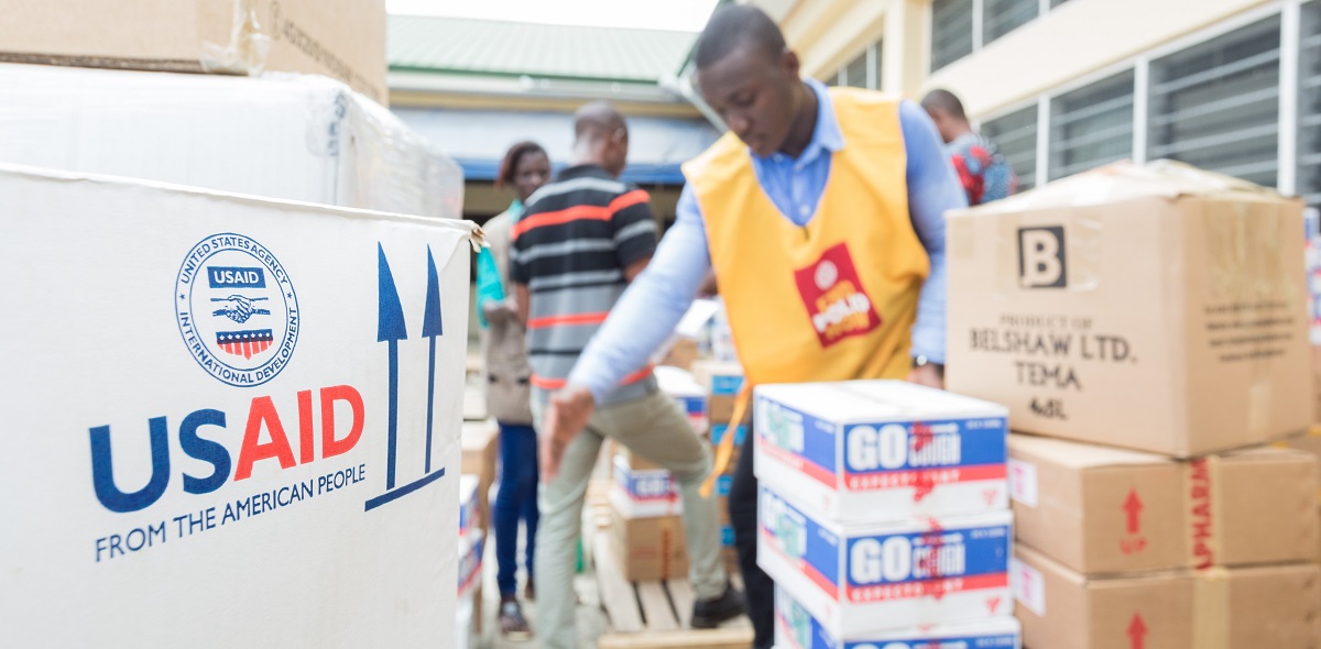 Image of a man loading boxes for last mile delivery in Ghana