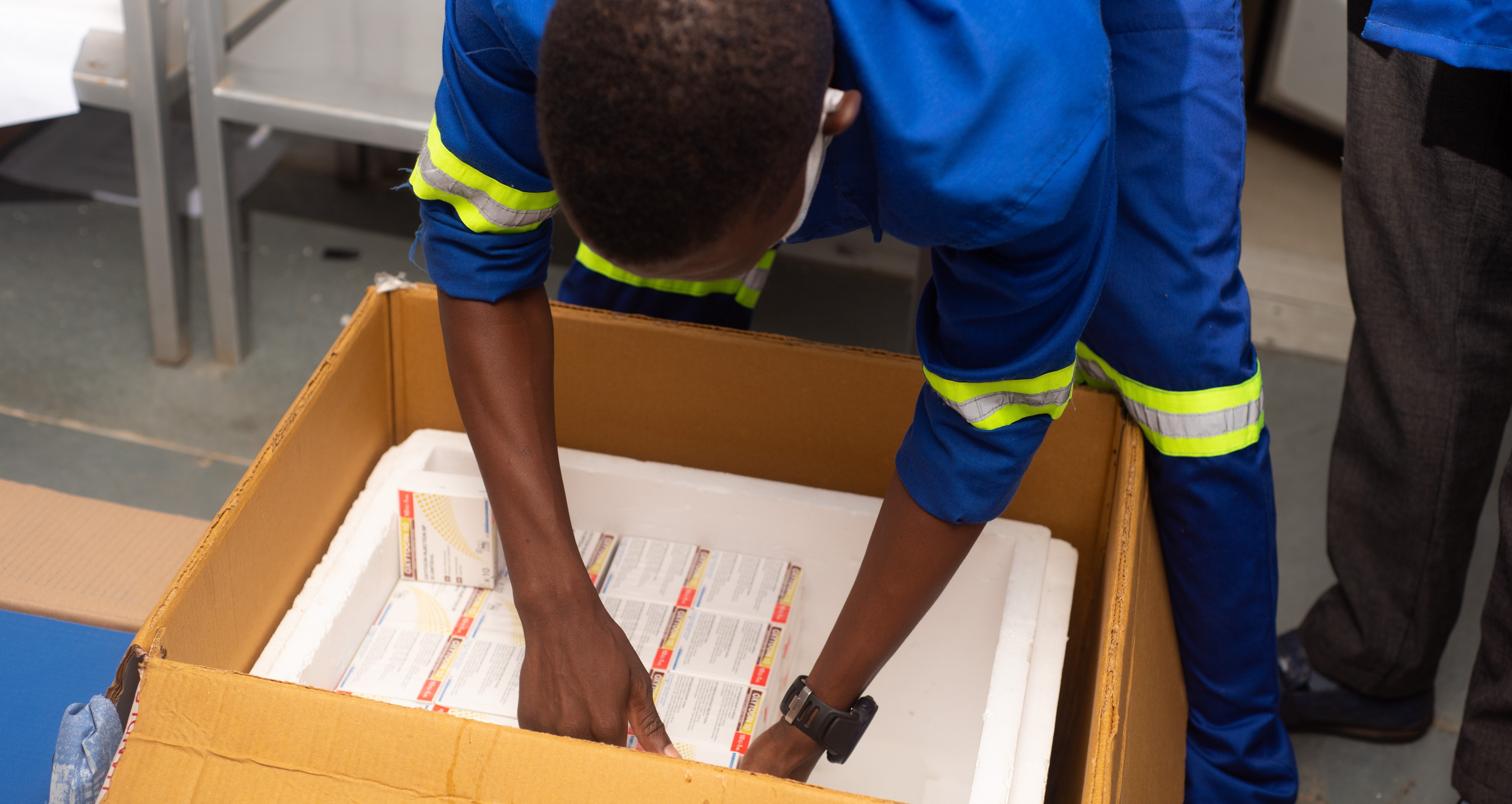 warehouse staff pack oxytocin into boxes