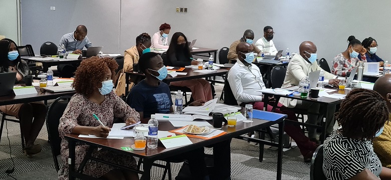 Participants being trained on QAT in Zimbabwe.