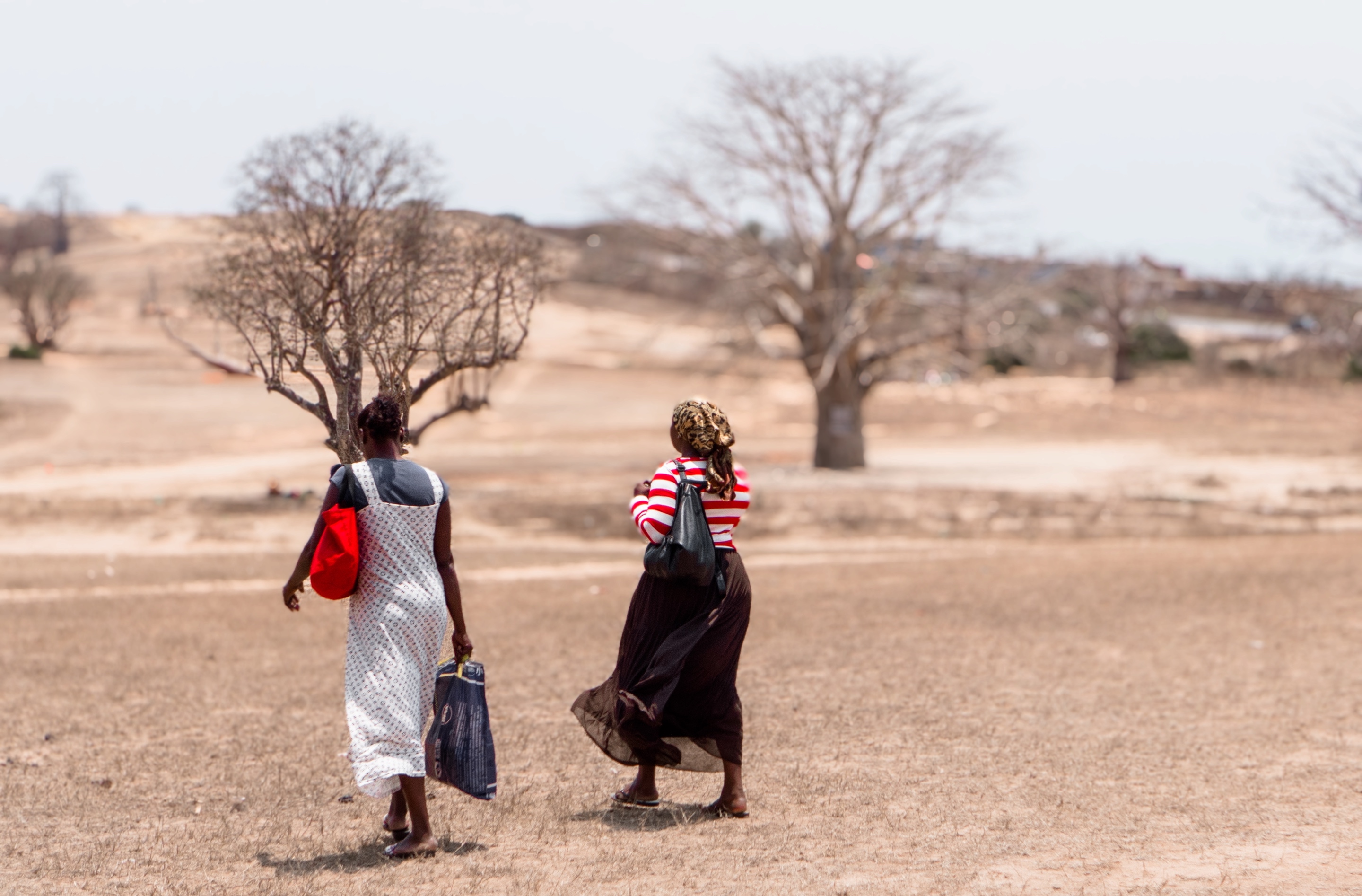 Two women in Angola walk to receive family planning services.