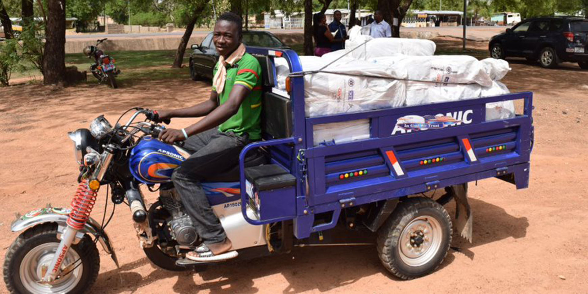 LLIN delivery taking place with a motorized tricycle.