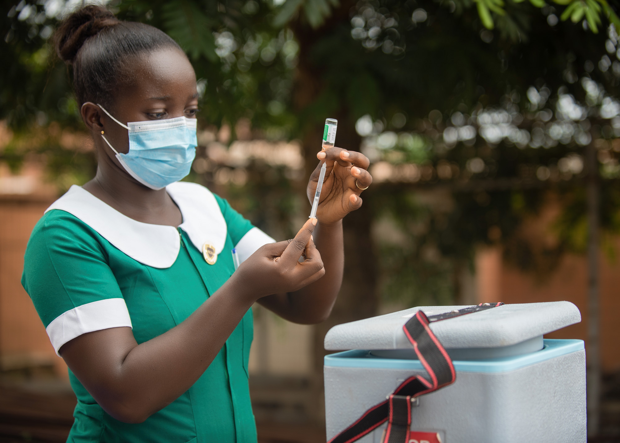 Joyce Dankwa, vaccinating a client during a community outreach exercise. Photo credit: GHSC-PSM