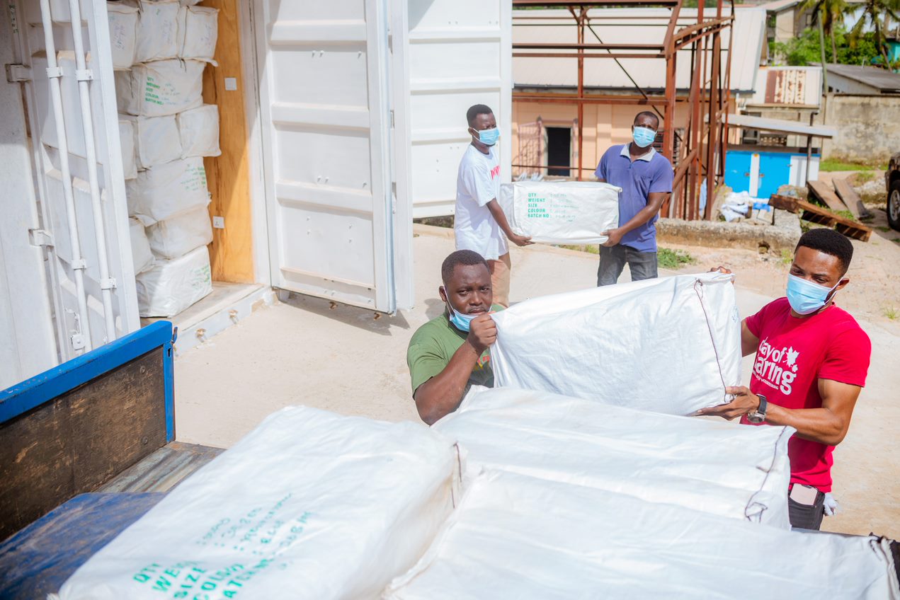 RMS staff loading LLINs into the region's truck