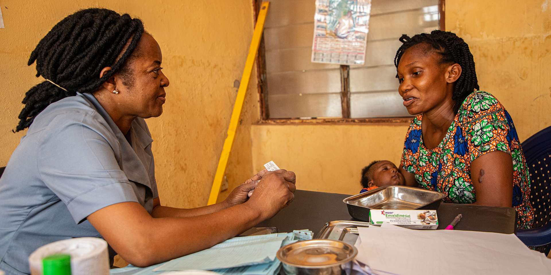 Ginika Nniekwe holding 2-month-old Raymond. 