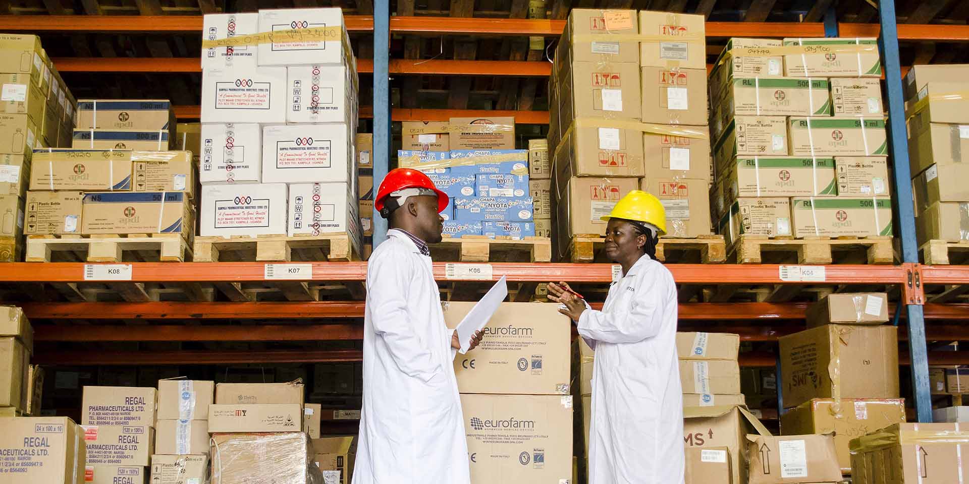 Two people in a warehouse in Uganda