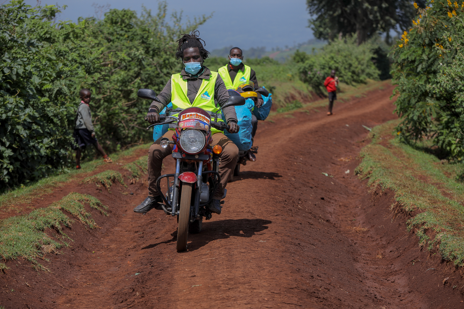 Motorbike Riders With Mosquito Nets