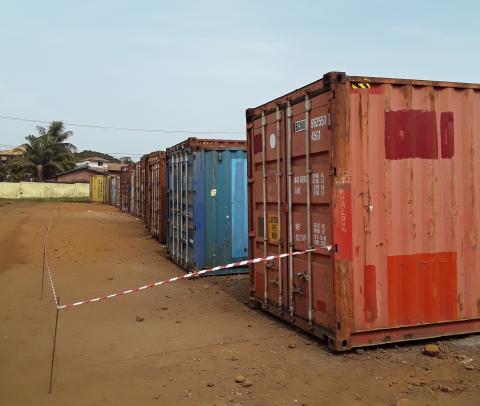 Seventeen secure containers store 150 tons of segregated waste ready for export and destruction.