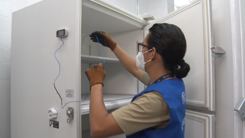 Staff using temperature sensor. Photo credit: GHSC-PSM/Lissette Figueroa