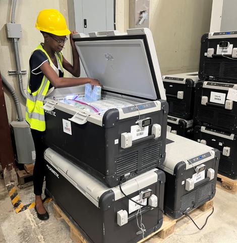 Pharmacist Charline Carolus monitoring solar fed cold boxes